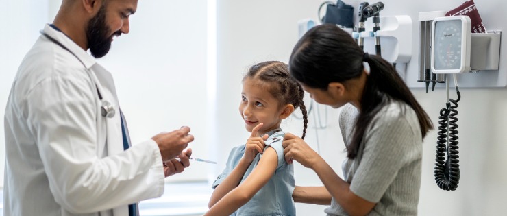 A young girl receives a flu vaccination ahead of flu season this winter.
