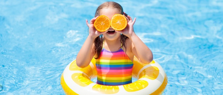 Happy child swimming in pool