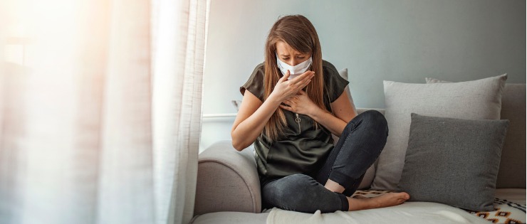 Young woman suffering from asthma due to mould in her home