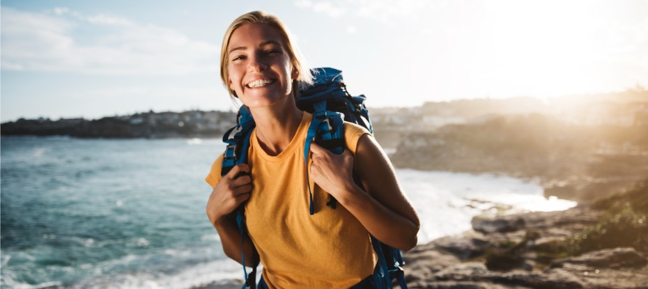 female backpacker ready to embark in her solo trip